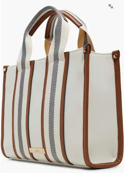 I am selling a brand new Aldo tote bag with crossbody strap included. Cute striped design with vegan...