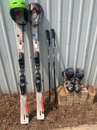 Skis, poles, ski boots, helmet, goggles 
