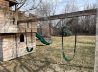Play structure with 3 swing sets and wave slide