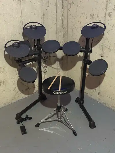 I'm selling an electric drum set that's perfect for beginners or experienced drummers looking for a...
