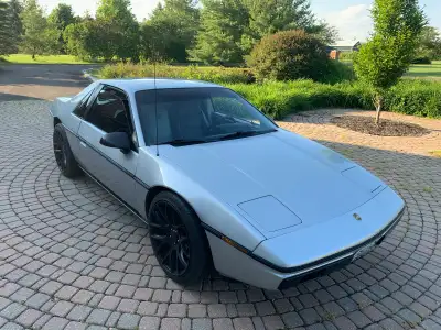 Great condition 1985 Fiero. 4 cylinder. 5 speed manual. Grey exterior. Grey interior. Original paint...