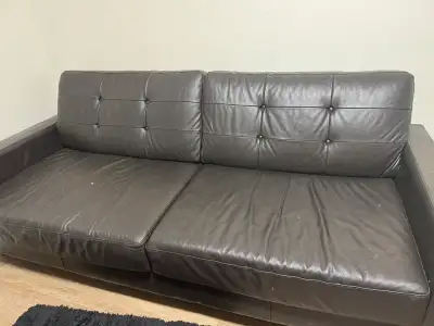 Beautiful genuine leather sofa from Leon’s in a rich deep coffee colour. Features stylish button-tuf...