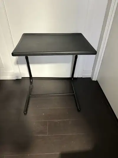 This folding table is a versatile and convenient addition to any home. The table is in used conditio...