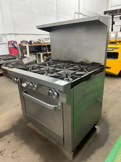You are viewing a used commercial restaurant US Range 6 burner stove top with convection oven. There...