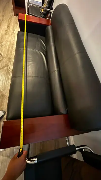 $80 - black leather couch with wooden arms, View more