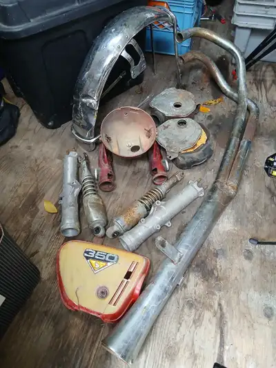 Restore your classic motorcycle with this collection of used vintage Honda CB350 parts, featuring es...