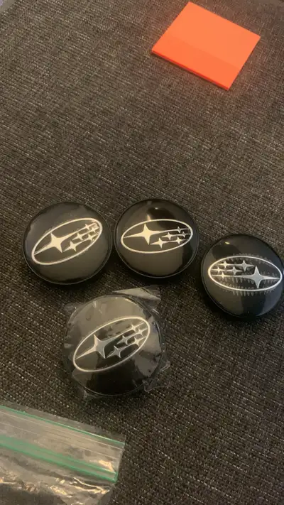 Black, 60 mm Subaru centre caps for rims Brand, new and package Check out my ads for other car items