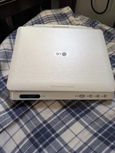 Portable LG DVD player for car. Comes with remote and cigarette lighter charger. Has the bag to hook...