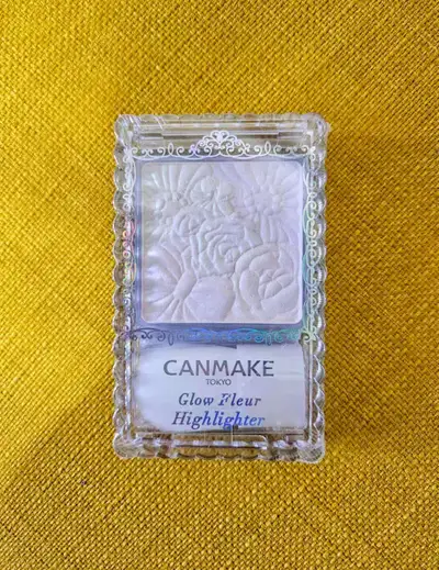 Get your glow on with this Canmake Tokyo Glow Fleur Highlighter! This cosmetic item is perfect for a...