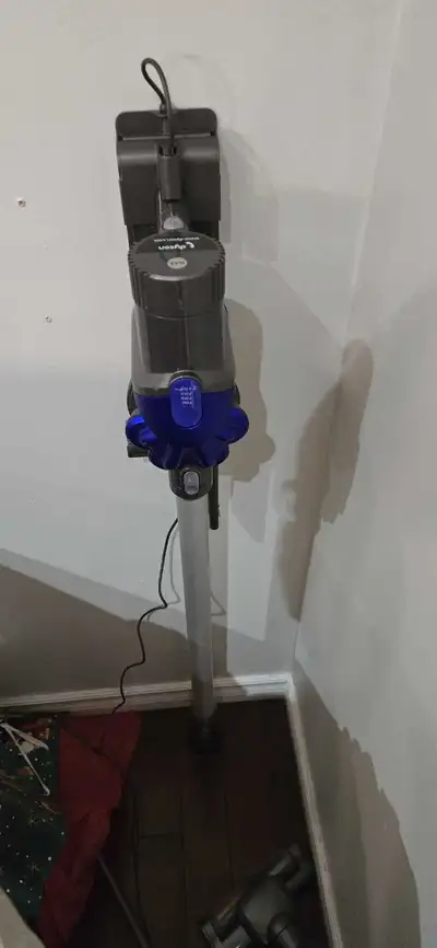 Two Dyson vacuum cleaners (DC35 and V6), View more