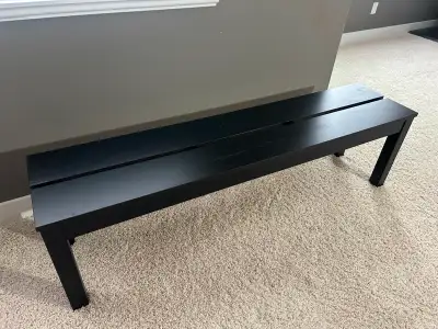 Moving out sale. Selling a versatile 5-foot black solid wood bench in good condition. Great for mini...
