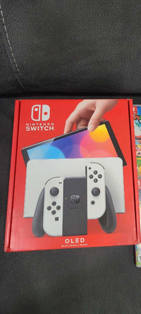 BNIB nintendo switch oled bundle with games and pro controller 