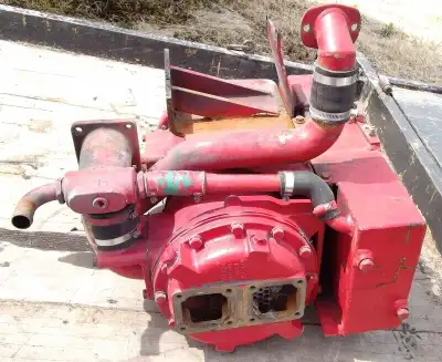 For sale a heat exchanger and expansion tank and piping off a Cummins NTC or N14 marine diesel engin...