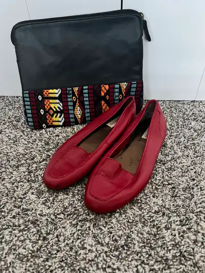 Beautiful red vintage shoes and this newer modern statement handbag. They look great together, but a...