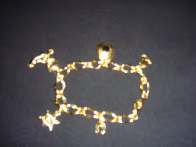 Approximately 71/2" long Lobster claw clasp Charms: Small pair cowboy boots - 1/2" x 1/2" Cowboy hat...