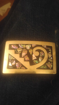 Abalone inlay in siver belt buckle.