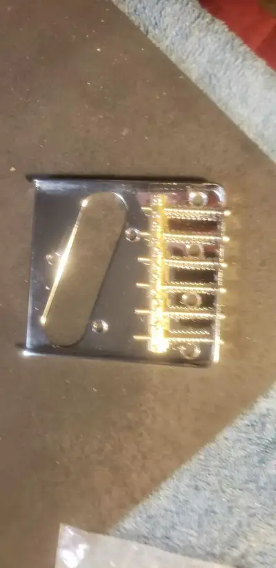 Upgrade your Telecaster with this used Fender Telecaster Bridge, complete with saddles! It's ready t...