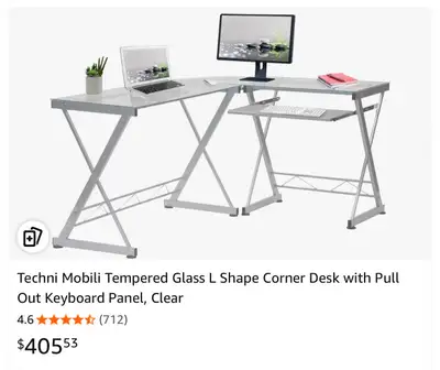 L shape glass computer desk silver/ grey base. $140 with computer chair for free if you want it or b...