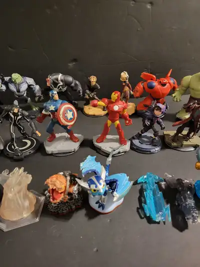 Skylanders and Disney Infinity figures with case. **Please note all have some kind of imperfection o...
