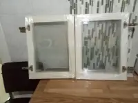 NEW 2 SET OF GLASS DOOR CABINETS