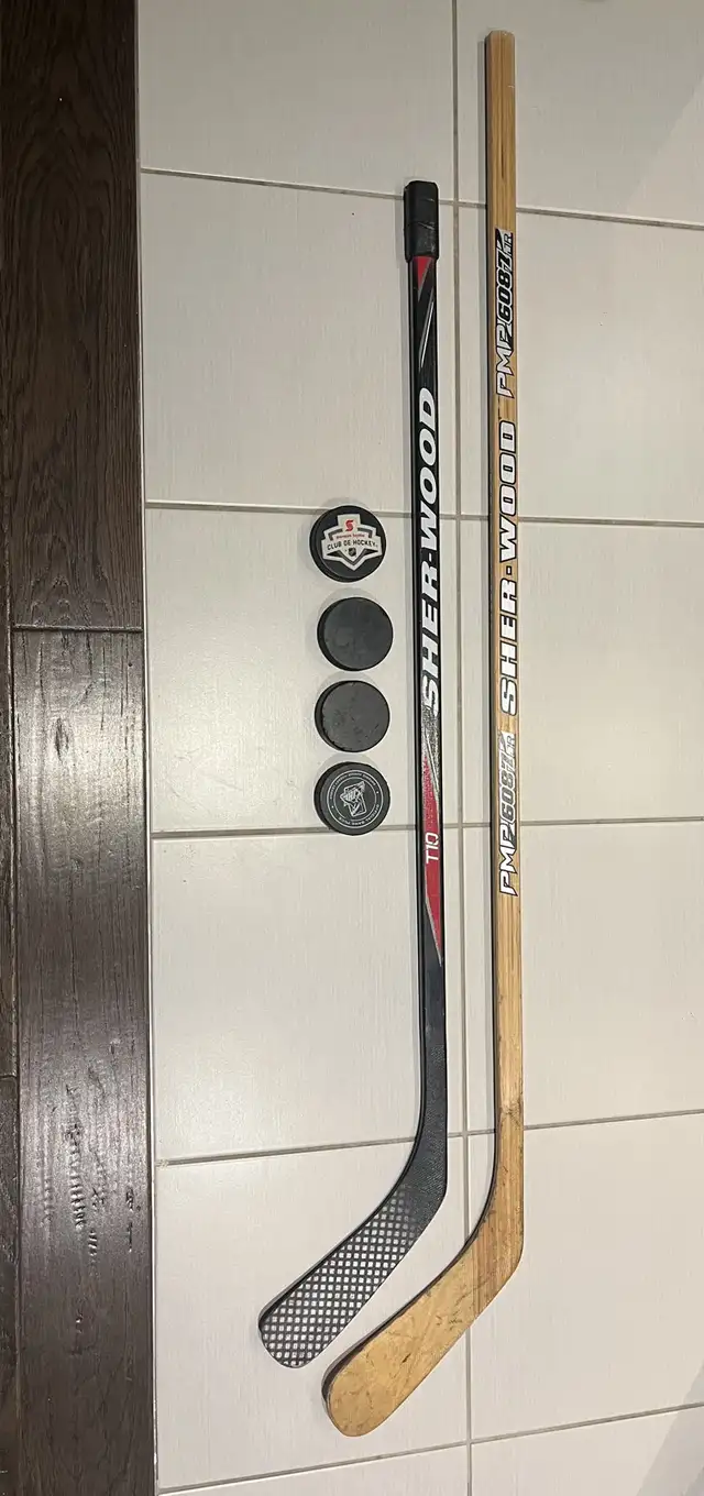 (2) HOCKEY STICKS and 4 pucks right handed sticks in Hockey in Markham / York Region - Image 2