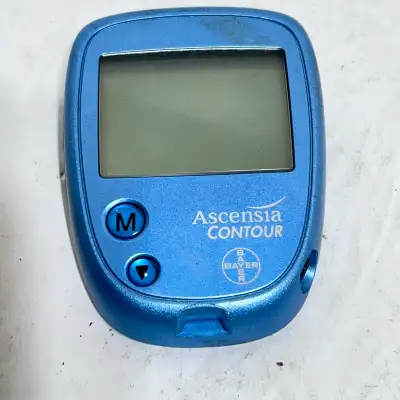 This is an Ascensia Contour blood glucose meter in used condition, but it still functions properly f...