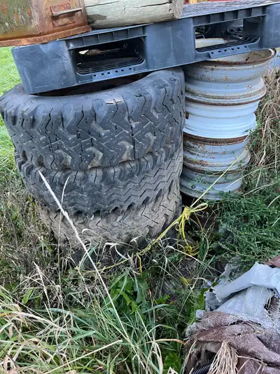 See the Stack of Tires w Rim's Mainly 16.5" except 2 of the dished ones that are 16" 7 Rims w Tires...