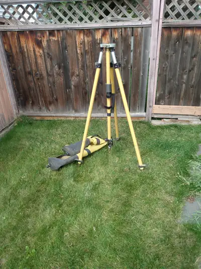 Aluminum heavy duty Tripod in good to fair condition. Extends to 2 meters in height, complete with c...