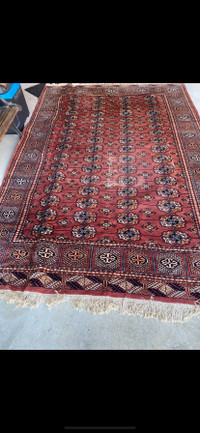 Antique hand knotted Bokhara wool rug. 3 metres by 2 metres.