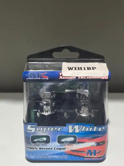 Factory sealed pair of A1C Super White H1 halogen headlight bulbs in the original retail packaging....