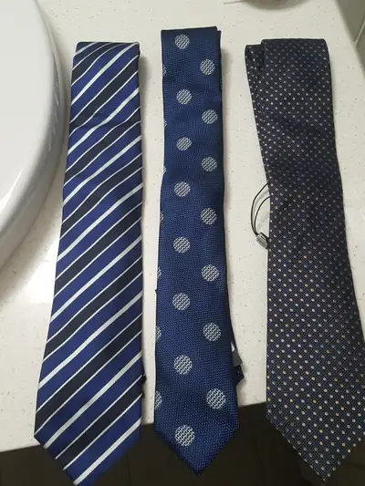 Selling all 3 of my Hugo Boss neckties. All were purchased at Holt Renfrew. Hand made in Italy. Tags...