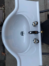 White porcelain Sink with taps
