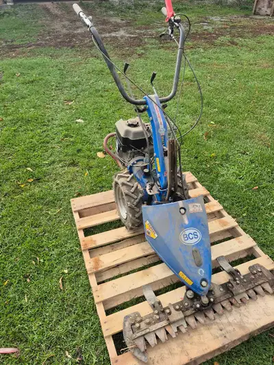 grass cutter.  ( sickle ), View more