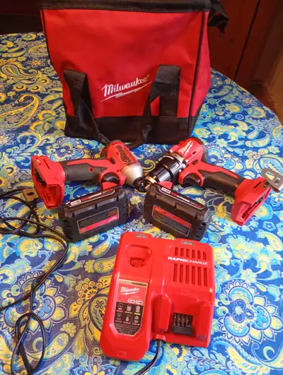 Impact drive and hammer drill+ 2 batteries M18 CP 2.0 , charger, and bag. Never used (brand new) ori...