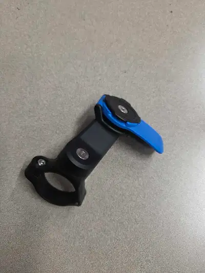 This is a used Quad Lock Bike Mount, perfect for securely attaching your smartphone to your bicycle....