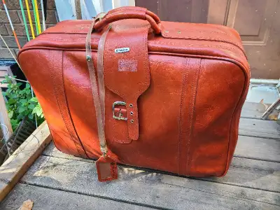Samsonite brown leather suitcase on wheels