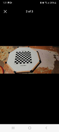 Crokinole board with checkers on backside 