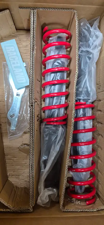 Raceland E39 rear kit only. Fronts are NOT available. Brand new struts and springs, complete, for an...