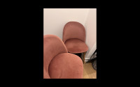 Two rose pink chairs nearly worth 300 CAD!