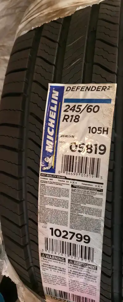 Selling a new 2 Michelin Defender tire, size 245/60R18 with a 105H load index and speed rating, perf...