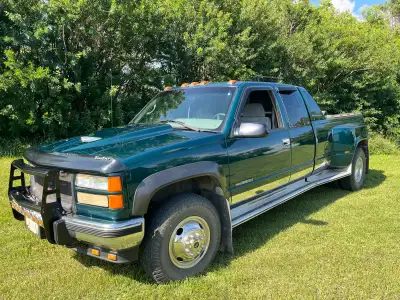 For sale 1995 GMC 1 ton dually, 4x4, 5 spd. standard, long box with 6.5 diesel motor, has pyro gauge...