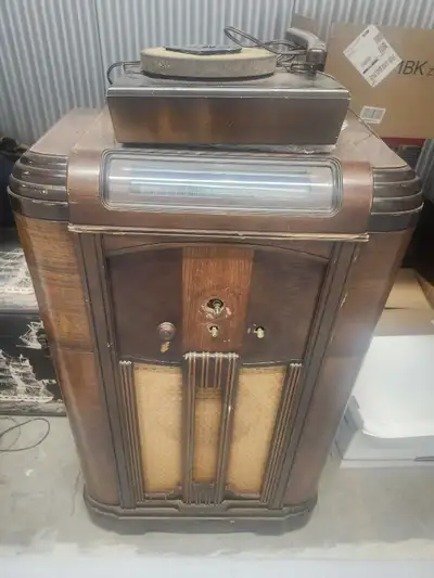 Includes auxiliary turntable. Radio band cylinder illuminates and spins to desired frequency. 40" ×...