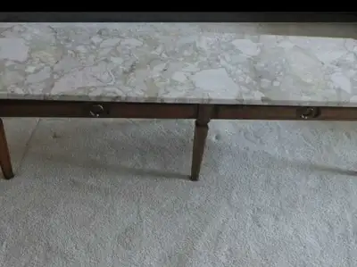 Very nice marble top coffee table in excellent condition. Marble top has no chips or cracks. Very he...