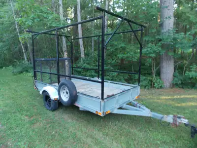 Galvanized North Trail utility trailer 5X10 with steel rack made to carry a boat over top of your AT...
