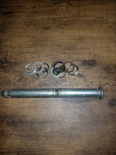 This bicycle trailer axle, accompanied by its washers, is in used condition and ready for a new home...