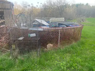 Free trampoline theres metal / animal / bird cages snow fence , and some metal odds .