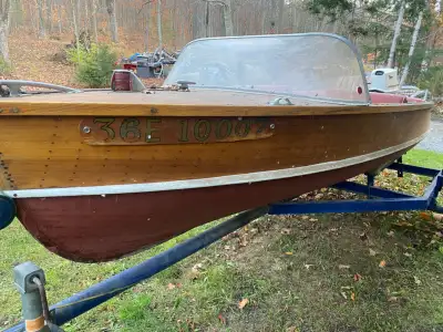 14’ Cedar Strip Boat , great for someone looking for a winter project. Comes on a trailer with a 196...