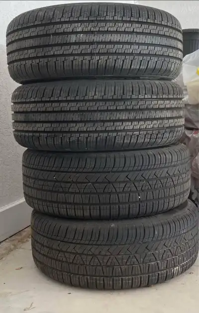 Tires with rims. The tires have a five bolt pattern.