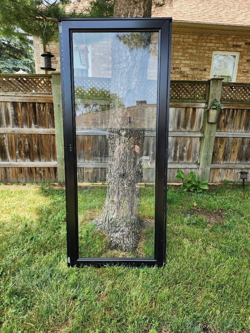 Black door 32"x 80" . Storm / Screen Windows, Doors & Trim