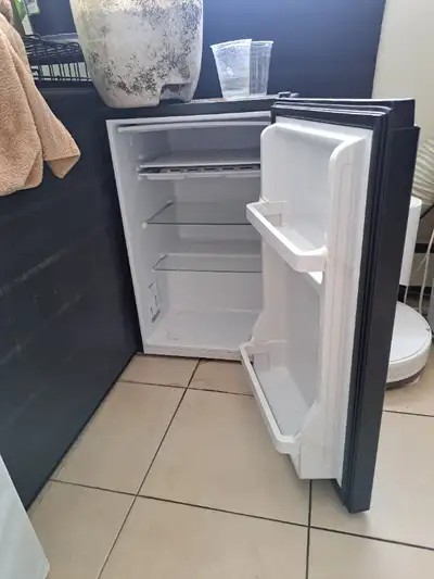 Black mini fridge for sale. Make an offer.